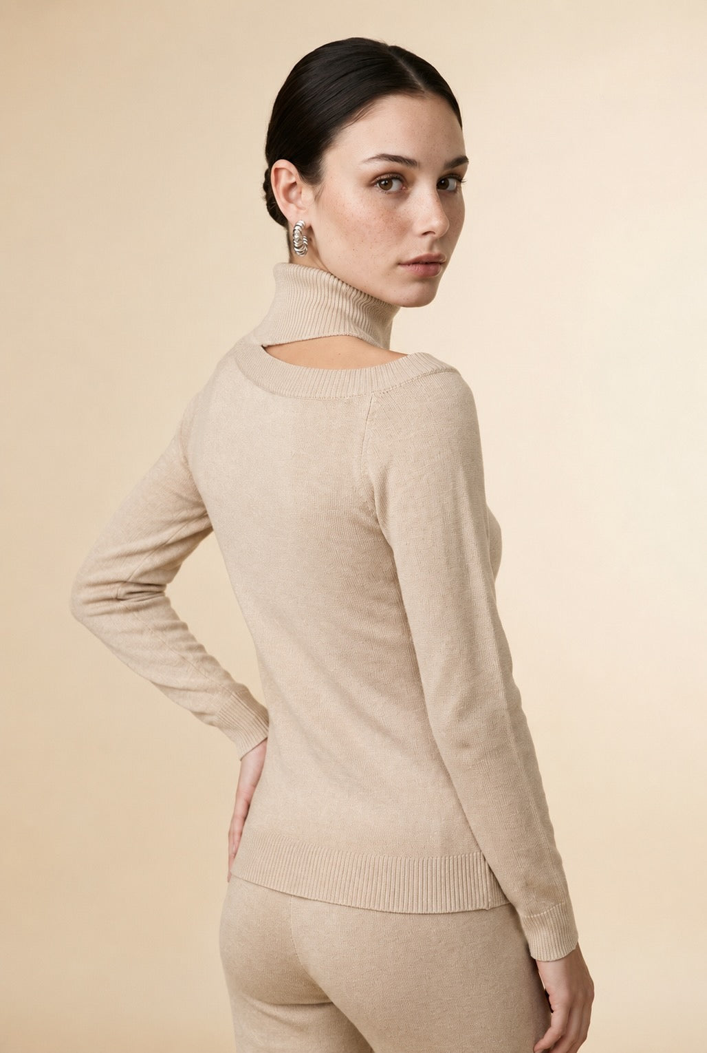 Cleo Asymmetrical Shoulder Cut-Out Turtleneck Top in Beige | Casa Maly