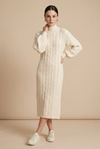 Maia Longo long-sleeve knit midi dress in off white featuring a round neckline and fitted silhouette