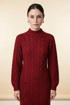 Model wearing the burgundy Maia Longo long-sleeve cable-knit maxi dress with a mock neck and ribbed cuffs