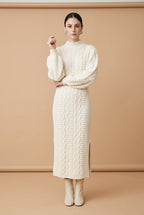 Maia Longo long-sleeve knit midi dress in off white featuring a round neckline and fitted silhouette