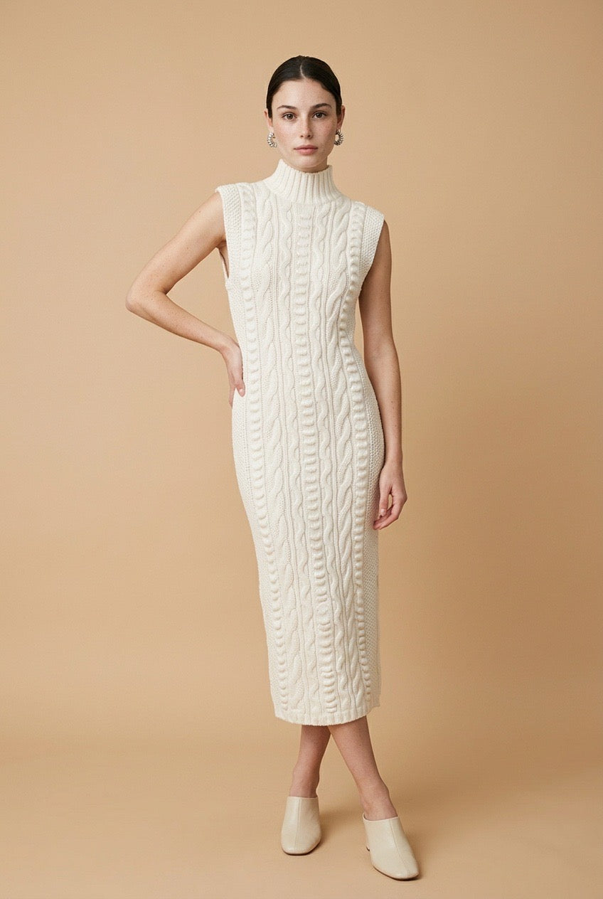 Maia sleeveless dress in off white featuring a delicate textured pattern, high neckline, and flowy silhouette