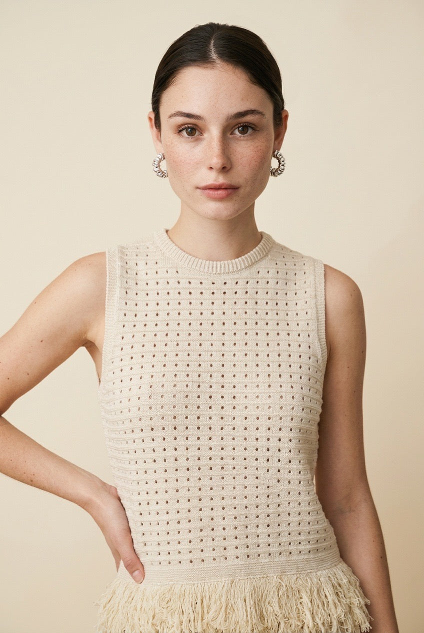 Nerano sleeveless knit top in beige featuring a crew neck, open-knit texture, and fringe hem trim