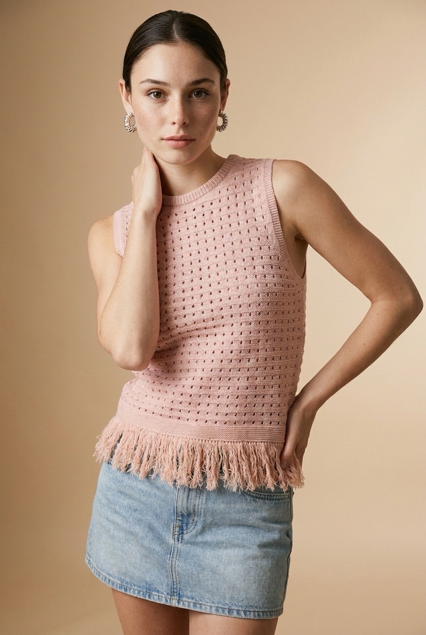 Nerano sleeveless knit top in pink featuring a crew neck, open-knit texture, and fringe hem trim